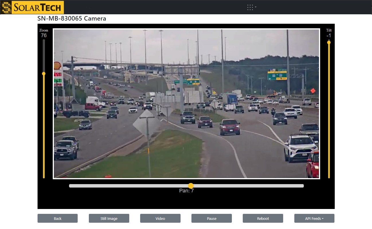 A camera feed in WebSuite showing highway traffic, with controls for still image and video